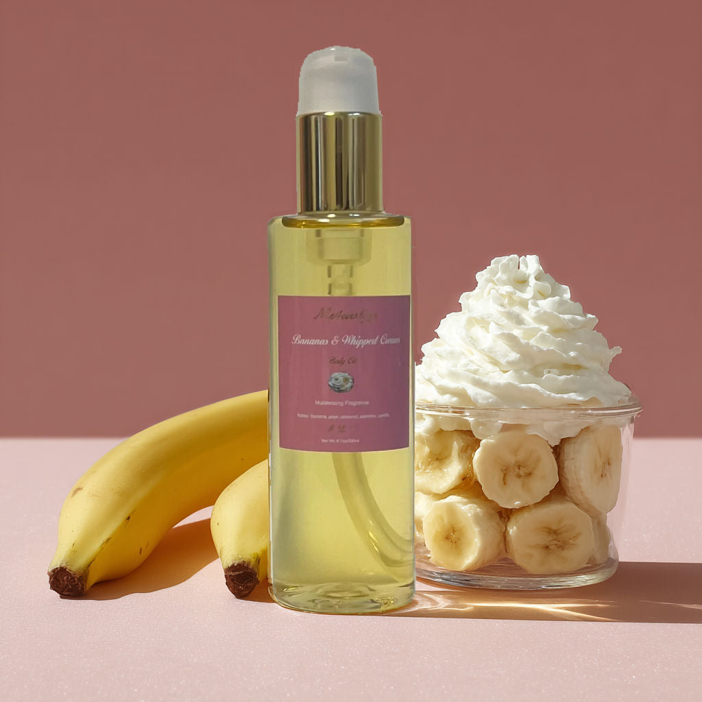 Bottle of banana body  oil with bananas and whipped cream on a pink background